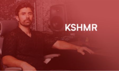 A man sits at a computer, focused on KSHMR Tutorials displayed on the screen.

